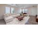 Comfortable living space bathed in natural light, featuring a modern sofa and minimalist decor at 950 E Kelsi Ave, San Tan Valley, AZ 85140