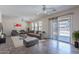 Inviting living room is filled with natural light and offers access to the backyard patio at 950 E Kelsi Ave, San Tan Valley, AZ 85140