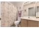 Clean bathroom featuring a vanity, toilet, and shower with a floral curtain at 950 N Sailors Way, Gilbert, AZ 85234