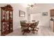 Dining room featuring tile flooring, neutral paint, and a glass top table with comfortable chairs at 950 N Sailors Way, Gilbert, AZ 85234