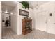 Bright entryway with decorative tile flooring, a glass display cabinet and a pendant light at 950 N Sailors Way, Gilbert, AZ 85234