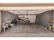 Spacious garage with concrete block walls and ample storage space for vehicles and belongings at 950 N Sailors Way, Gilbert, AZ 85234