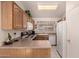 Bright kitchen with tile flooring, oak cabinets, and modern appliances at 950 N Sailors Way, Gilbert, AZ 85234