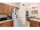 Bright kitchen featuring oak cabinets, and stainless steel appliances at 950 N Sailors Way, Gilbert, AZ 85234