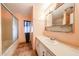 Dated bathroom features a shower-tub combo and a single sink vanity at 10951 N 91St Ave # 16, Peoria, AZ 85345