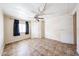 Bedroom features tile flooring, neutral walls, and ample natural light at 10951 N 91St Ave # 16, Peoria, AZ 85345