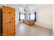 Bedroom with tiled floor, ceiling fan, and storage cabinet, offers a functional space at 10951 N 91St Ave # 16, Peoria, AZ 85345