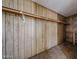 Simple closet with a wood panel and shelf, providing functional storage at 10951 N 91St Ave # 16, Peoria, AZ 85345