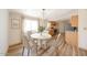 Cozy dining area with a chandelier, a round table, and hardwood floors near the kitchen at 10951 N 91St Ave # 16, Peoria, AZ 85345