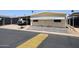 Cozy single-story home featuring a covered parking area and low-maintenance gravel landscaping at 10951 N 91St Ave # 16, Peoria, AZ 85345
