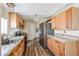 Functional kitchen with wood cabinets and laminate countertops at 10951 N 91St Ave # 16, Peoria, AZ 85345