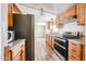 Cozy kitchen featuring wood cabinets and stainless steel appliances at 10951 N 91St Ave # 16, Peoria, AZ 85345