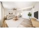 Open-concept living room featuring hardwood floors, neutral walls, and ample natural light at 10951 N 91St Ave # 16, Peoria, AZ 85345