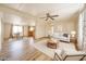 Bright living room featuring hardwood floors, a ceiling fan, and an open-concept layout at 10951 N 91St Ave # 16, Peoria, AZ 85345