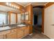 Bathroom features a double sink vanity with new floors and decor at 11526 W Bermuda Dr, Avondale, AZ 85392