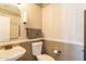 Small bathroom featuring a toilet, sink, and decorative wallpaper border at 11526 W Bermuda Dr, Avondale, AZ 85392