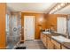 Bright bathroom featuring dual sinks, a spacious shower, and modern fixtures for a luxurious feel at 11526 W Bermuda Dr, Avondale, AZ 85392