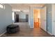 Spacious bedroom with natural light, ceiling fan, wood-look floors, and neutral paint at 11526 W Bermuda Dr, Avondale, AZ 85392