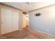 Bedroom featuring carpet, closet, ceiling fan and neutral colors at 11526 W Bermuda Dr, Avondale, AZ 85392