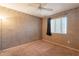 Neutral bedroom featuring neutral walls, window with blinds and carpet at 11526 W Bermuda Dr, Avondale, AZ 85392