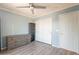 Bedroom featuring a ceiling fan, wood-look floors, and a closet at 11526 W Bermuda Dr, Avondale, AZ 85392