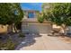 Charming two-story home with a well-maintained lawn and a two car garage at 11526 W Bermuda Dr, Avondale, AZ 85392