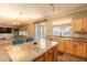 Kitchen island with seating area, granite countertops, and modern appliances, perfect for cooking at 11526 W Bermuda Dr, Avondale, AZ 85392