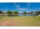 Peaceful park featuring tranquil lake views, inviting benches, and manicured lawns, creating a relaxing outdoor space at 11526 W Bermuda Dr, Avondale, AZ 85392