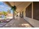 The covered patio offers a cool, shaded retreat overlooking the backyard oasis at 11526 W Bermuda Dr, Avondale, AZ 85392