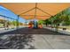 Community playground featuring swings, slides, and covered play area for hours of outdoor fun at 11526 W Bermuda Dr, Avondale, AZ 85392