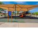 Community playground featuring colorful play structures and shaded areas at 11526 W Bermuda Dr, Avondale, AZ 85392