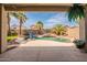 This backyard boasts a gorgeous pool with a rock waterfall feature, perfect for relaxing or entertaining at 11526 W Bermuda Dr, Avondale, AZ 85392