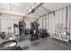 Wide angle of converted garage into a salon with seating, and garage doors at 11526 W Bermuda Dr, Avondale, AZ 85392