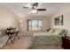 Inviting bedroom with ceiling fan and large window overlooking the desert landscape at 11543 W Sandsnake Ct, Surprise, AZ 85378