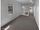Upstairs hallway with neutral carpeting, white railing and windows offering natural light at 13335 W Marlette Ct, Litchfield Park, AZ 85340