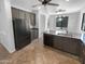 Kitchen featuring stainless steel appliances, tile flooring, and outside view at 13335 W Marlette Ct, Litchfield Park, AZ 85340