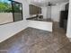 Spacious kitchen features granite countertops, modern appliances, and tile flooring at 13335 W Marlette Ct, Litchfield Park, AZ 85340