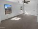The carpeted primary bedroom features dual windows and ceiling fan at 13335 W Marlette Ct, Litchfield Park, AZ 85340