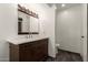 Stylish bathroom with dark wood cabinets, sleek hardware, and a well-lit mirror at 1402 E Guadalupe Rd # 234, Tempe, AZ 85283
