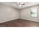 Bright bedroom with wood flooring and large windows bringing in natural light at 1402 E Guadalupe Rd # 234, Tempe, AZ 85283