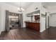 Dining room with dark wood floors and a sliding glass door at 1402 E Guadalupe Rd # 234, Tempe, AZ 85283