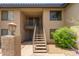 Apartment building featuring desert landscaping and exterior stairs at 1402 E Guadalupe Rd # 234, Tempe, AZ 85283