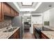 Kitchen featuring stainless steel appliances, granite countertops, and dark wood cabinets at 1402 E Guadalupe Rd # 234, Tempe, AZ 85283