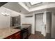 Kitchen featuring dark wood cabinets, granite countertops, and dark wood floors at 1402 E Guadalupe Rd # 234, Tempe, AZ 85283