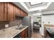 Kitchen featuring stainless steel appliances, granite countertops, and dark wood cabinets at 1402 E Guadalupe Rd # 234, Tempe, AZ 85283