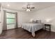 Main bedroom with wood floors, ceiling fan, and lots of natural light at 1402 E Guadalupe Rd # 234, Tempe, AZ 85283