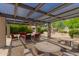 Spacious covered patio with ample seating and tables, perfect for outdoor entertaining and enjoying the serene surroundings at 1402 E Guadalupe Rd # 234, Tempe, AZ 85283