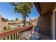 Balcony with table and chairs overlooking pool and landscaped community grounds at 14203 N 19Th Ave # 2036, Phoenix, AZ 85023
