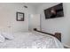 Serene bedroom with natural light, hardwood floors and a ceiling fan at 14203 N 19Th Ave # 2036, Phoenix, AZ 85023