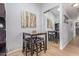 Stylish dining area with seating for four and mirrored closet doors at 14203 N 19Th Ave # 2036, Phoenix, AZ 85023